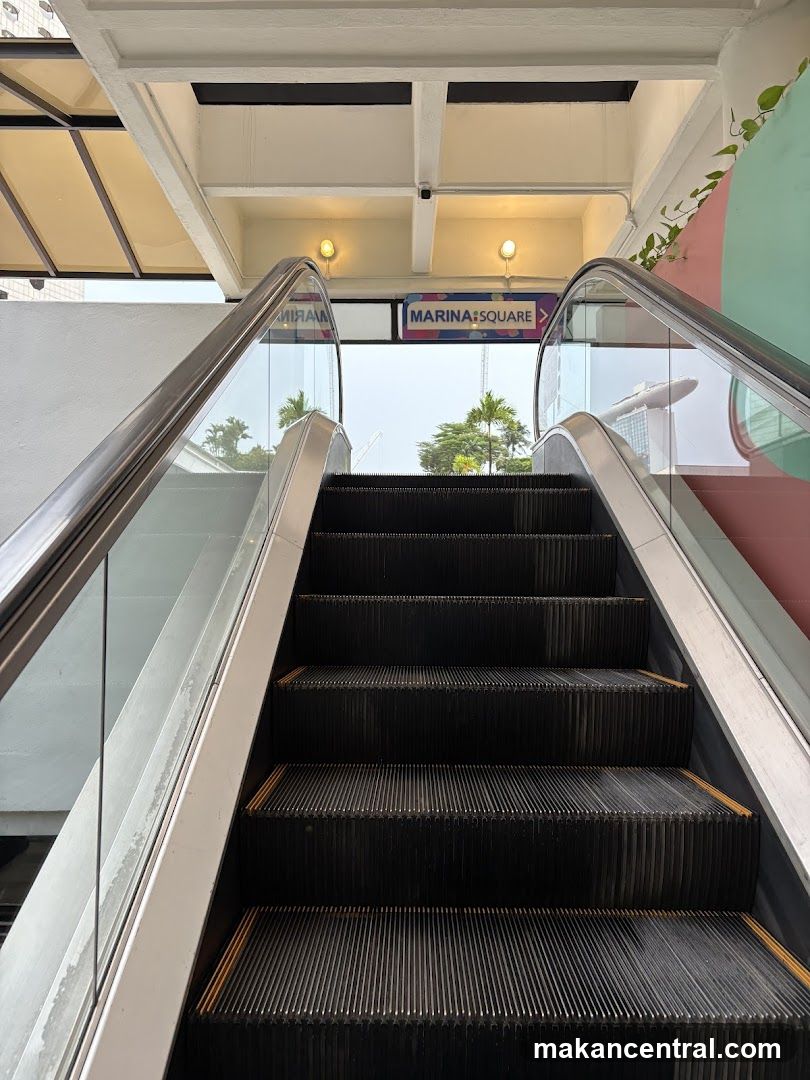 Escalator with Marina Square Sign