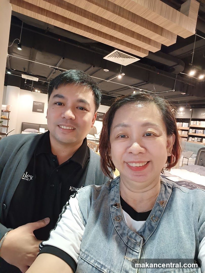 Two people smiling in a store
