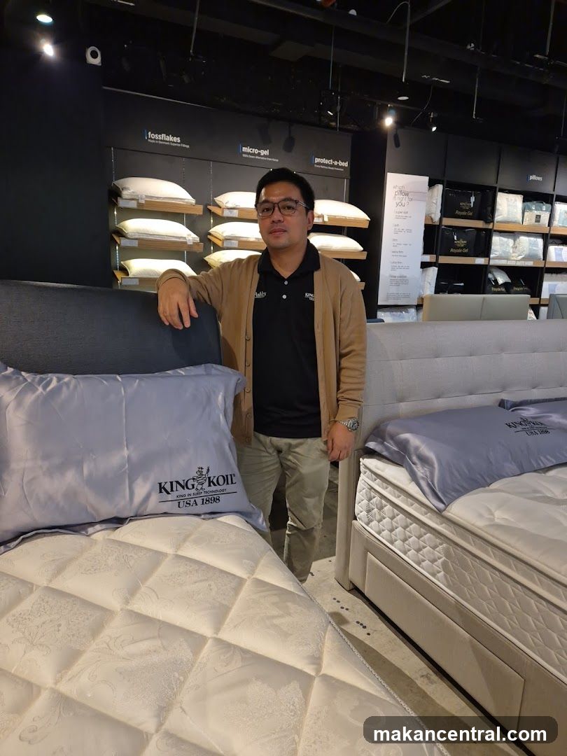 Man Posing in Mattress Store