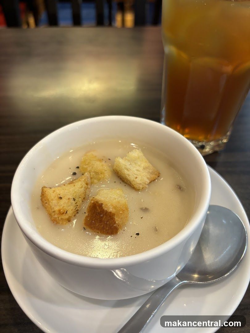 Creamy Soup with Croutons and Iced Tea