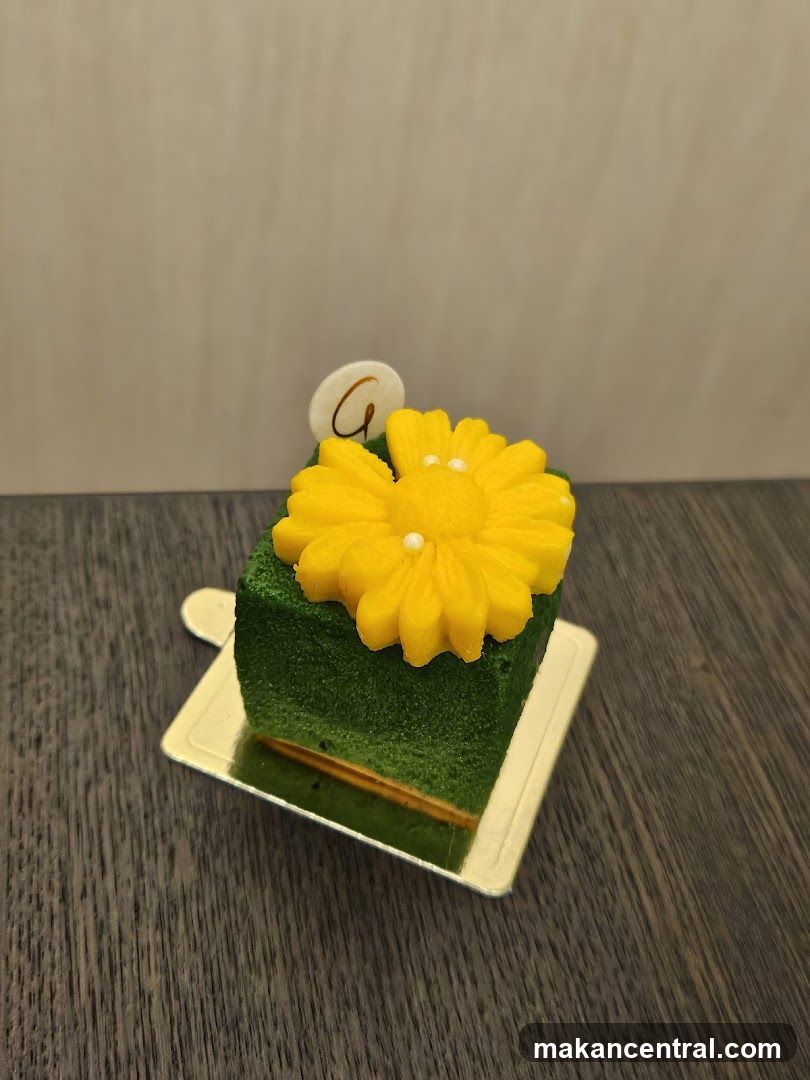 Green Cake with Yellow Flower Decoration