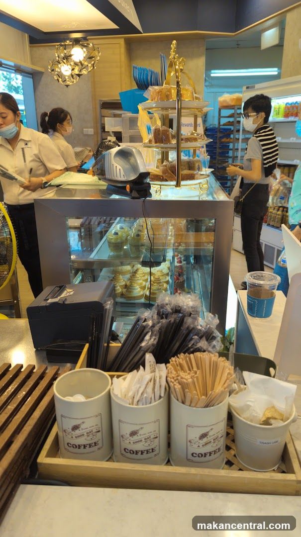 Bakery Counter with Pastries and Staff