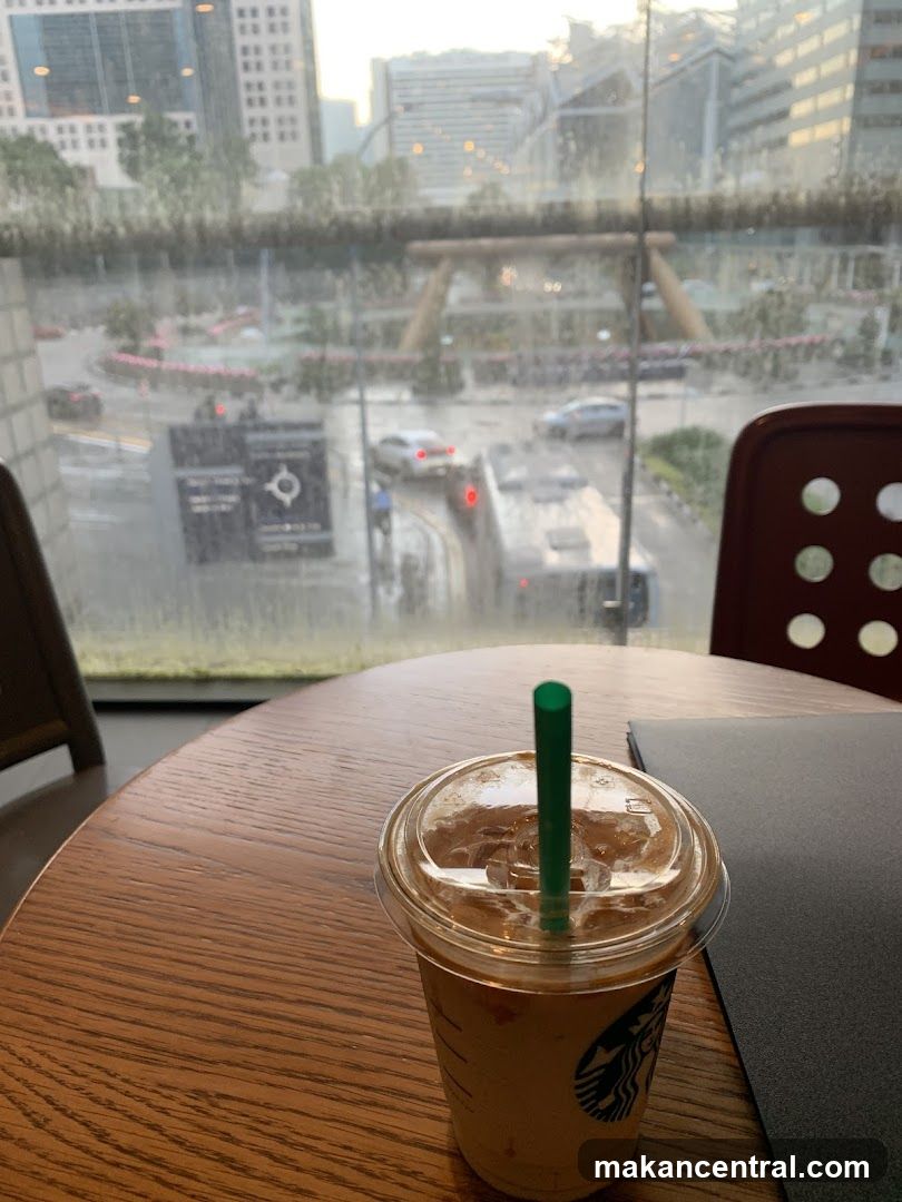 Iced Coffee on Table with City View