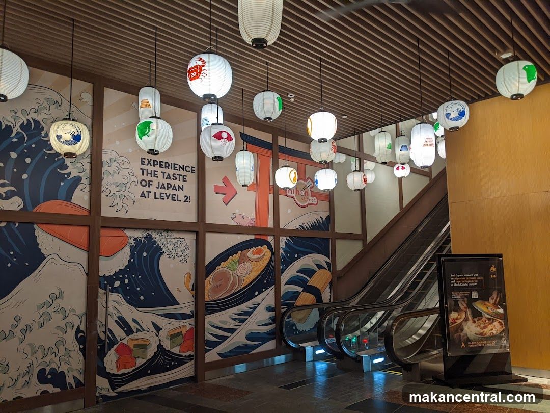 Japanese Themed Interior with Lanterns and Escalator