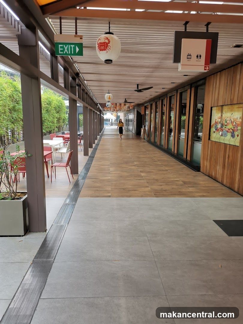 Outdoor walkway with shops and seating