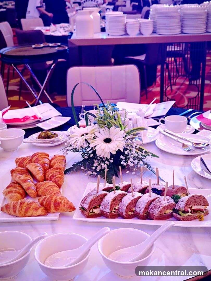 Buffet Table with Croissants and Sandwiches