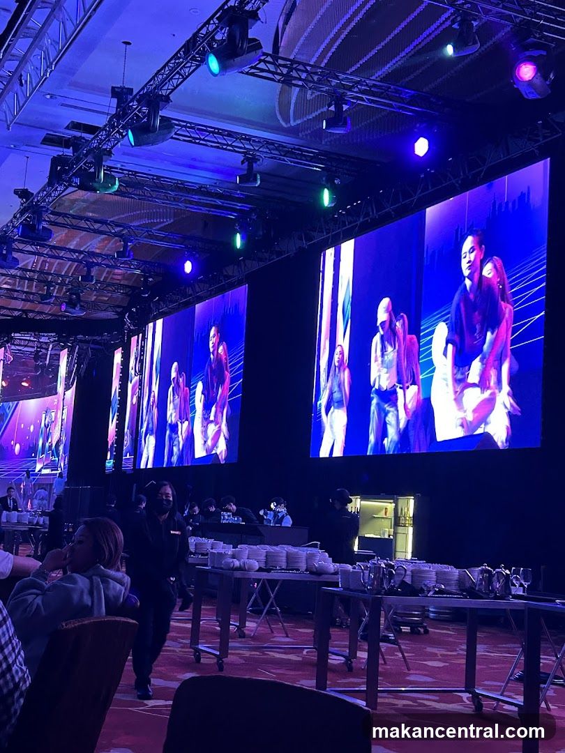 Event with large screens and catering setup