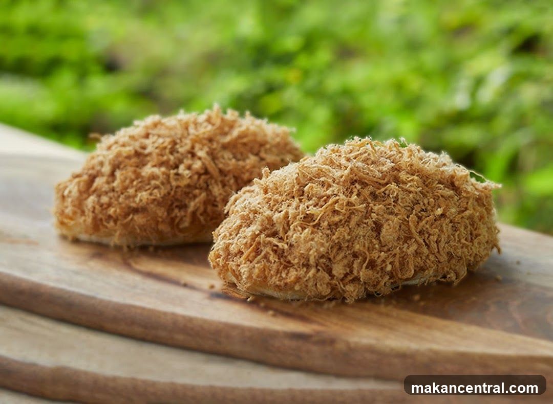 Two crispy food items on wooden board