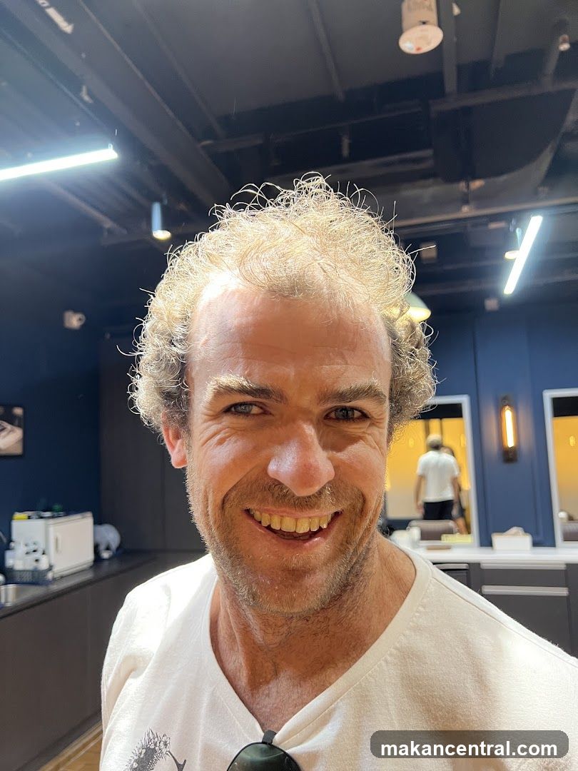 Man smiling in a salon