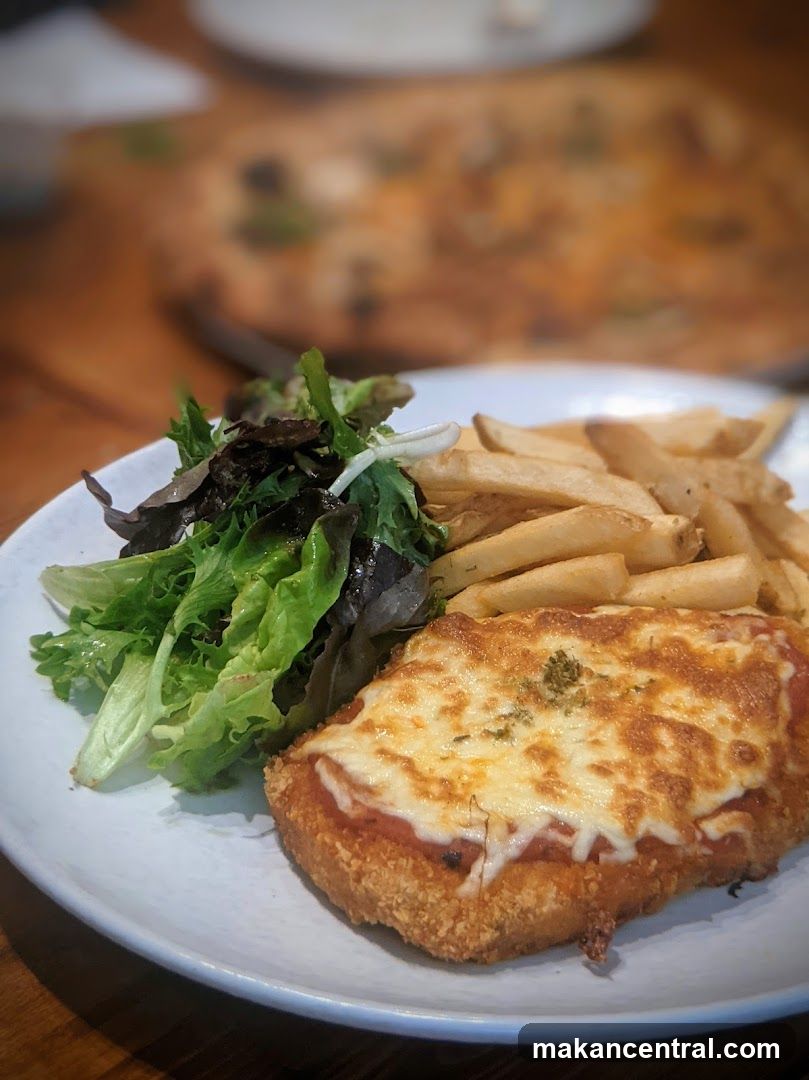 Chicken Parmi with Fries and Salad