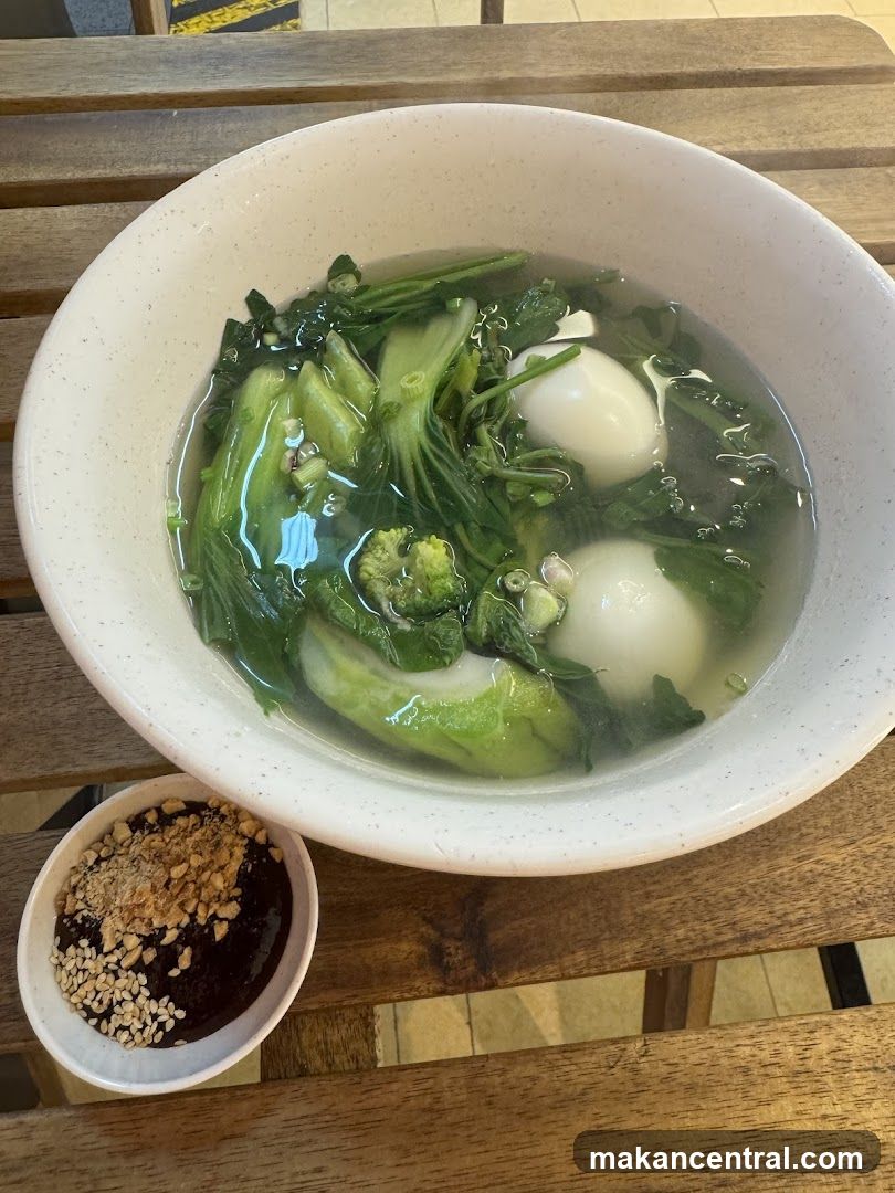 Soup with dumplings and greens
