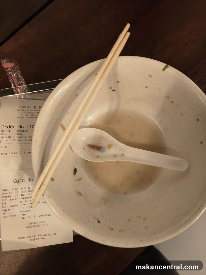 Empty Bowl with Chopsticks and Receipt