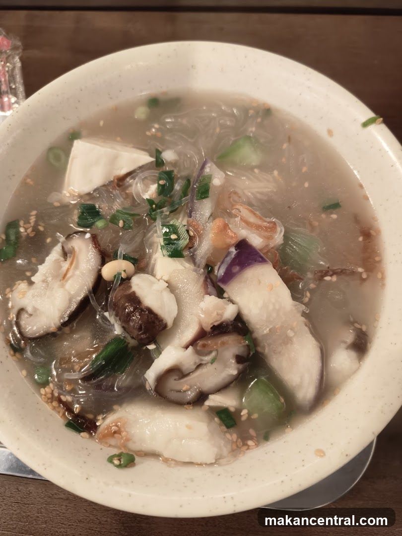 Soup with noodles, tofu, mushrooms, and eggplant