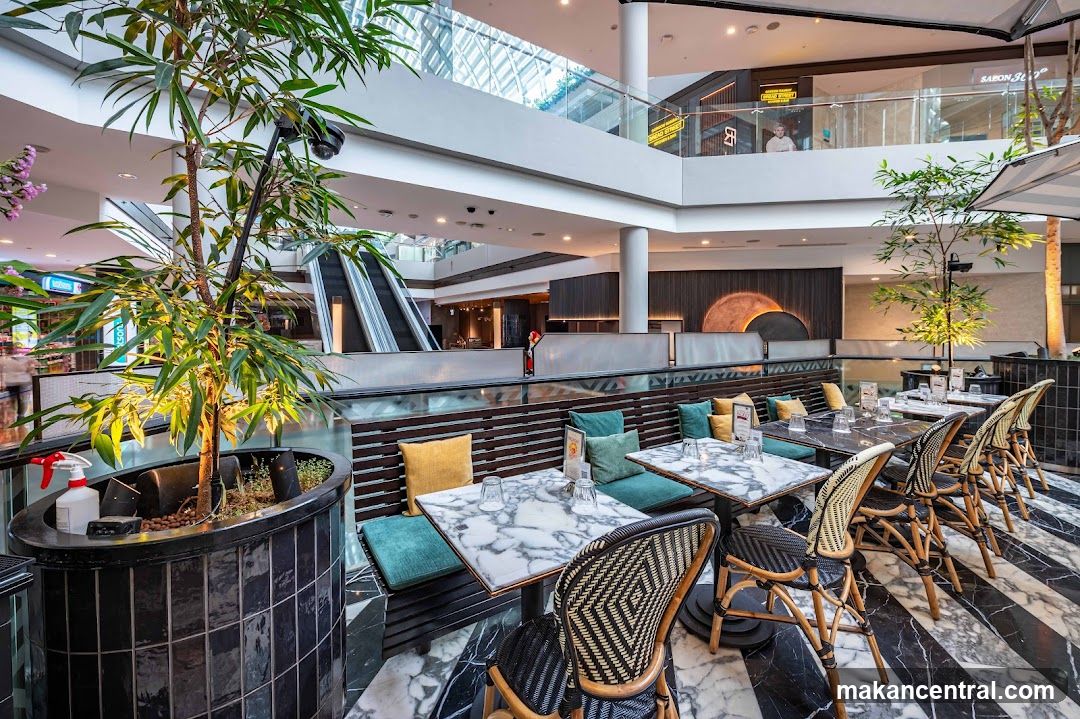 Restaurant Interior with Marble Tables and Wicker Chairs