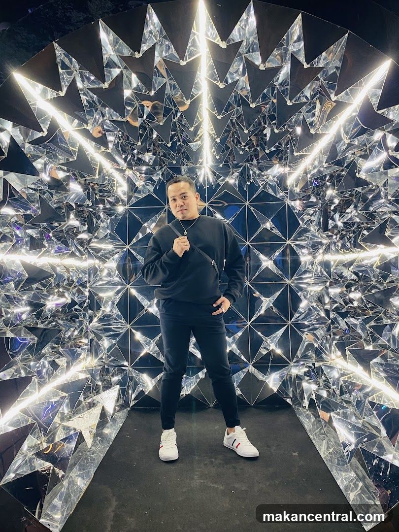 Man Posing in a Mirrored Room