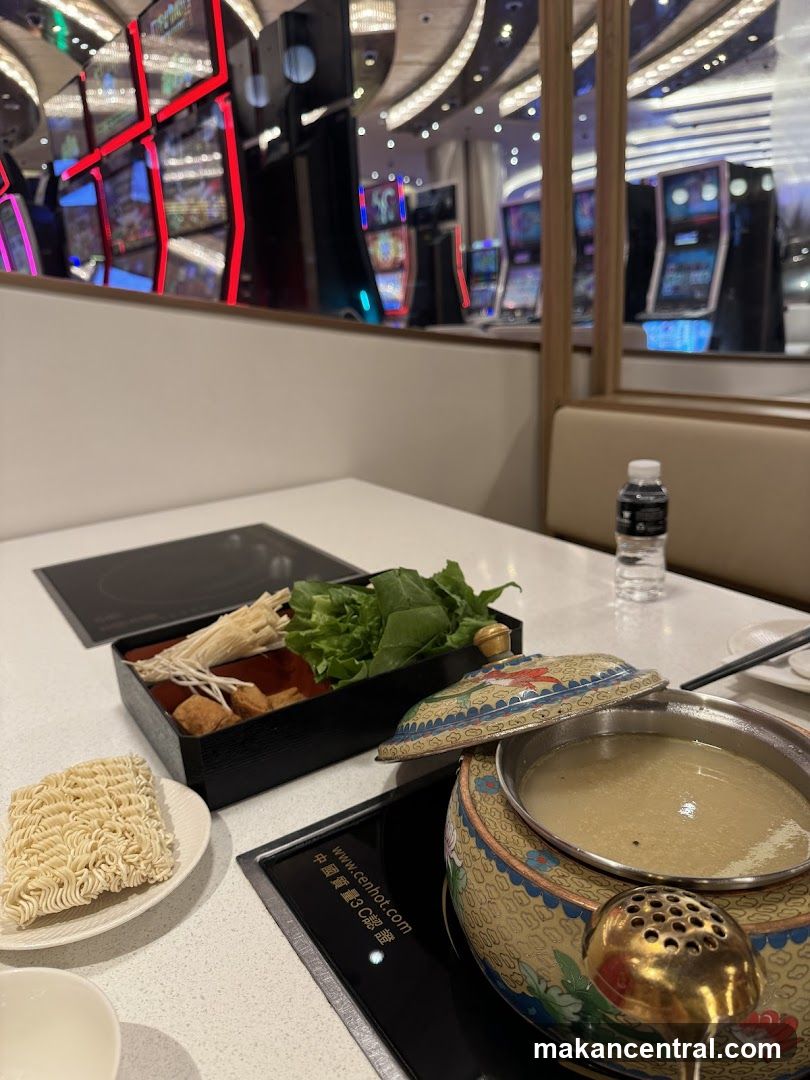 Hot Pot Meal with Slot Machines in Background
