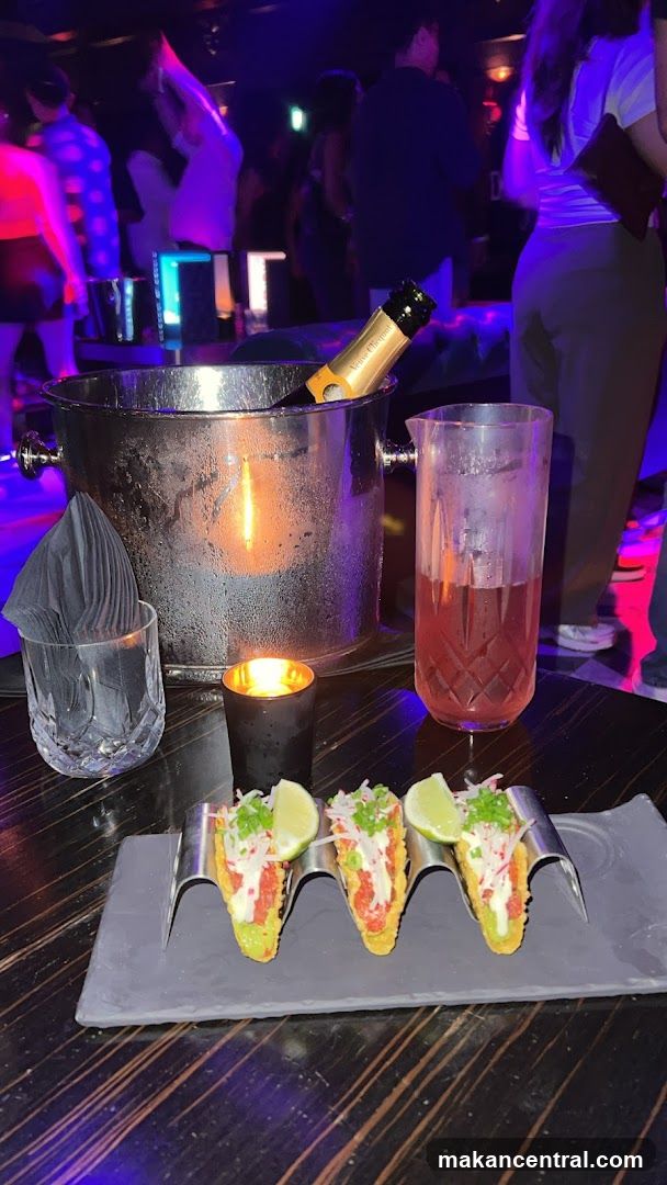 Tacos and Champagne at a Nightclub