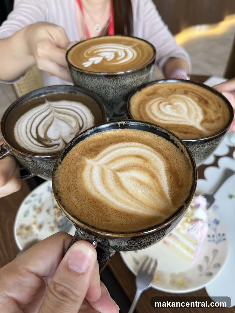 Four cups of coffee with latte art