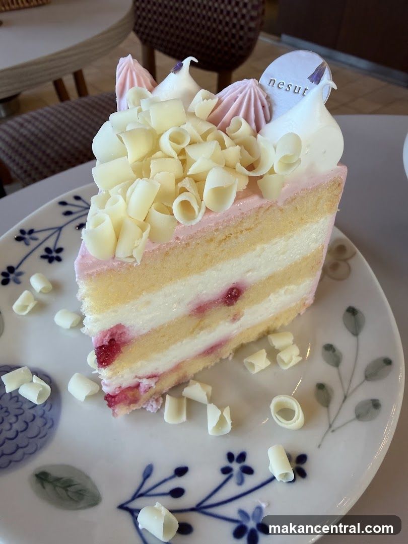 Slice of cake with white chocolate shavings