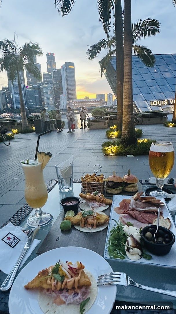 Outdoor dining with city skyline view