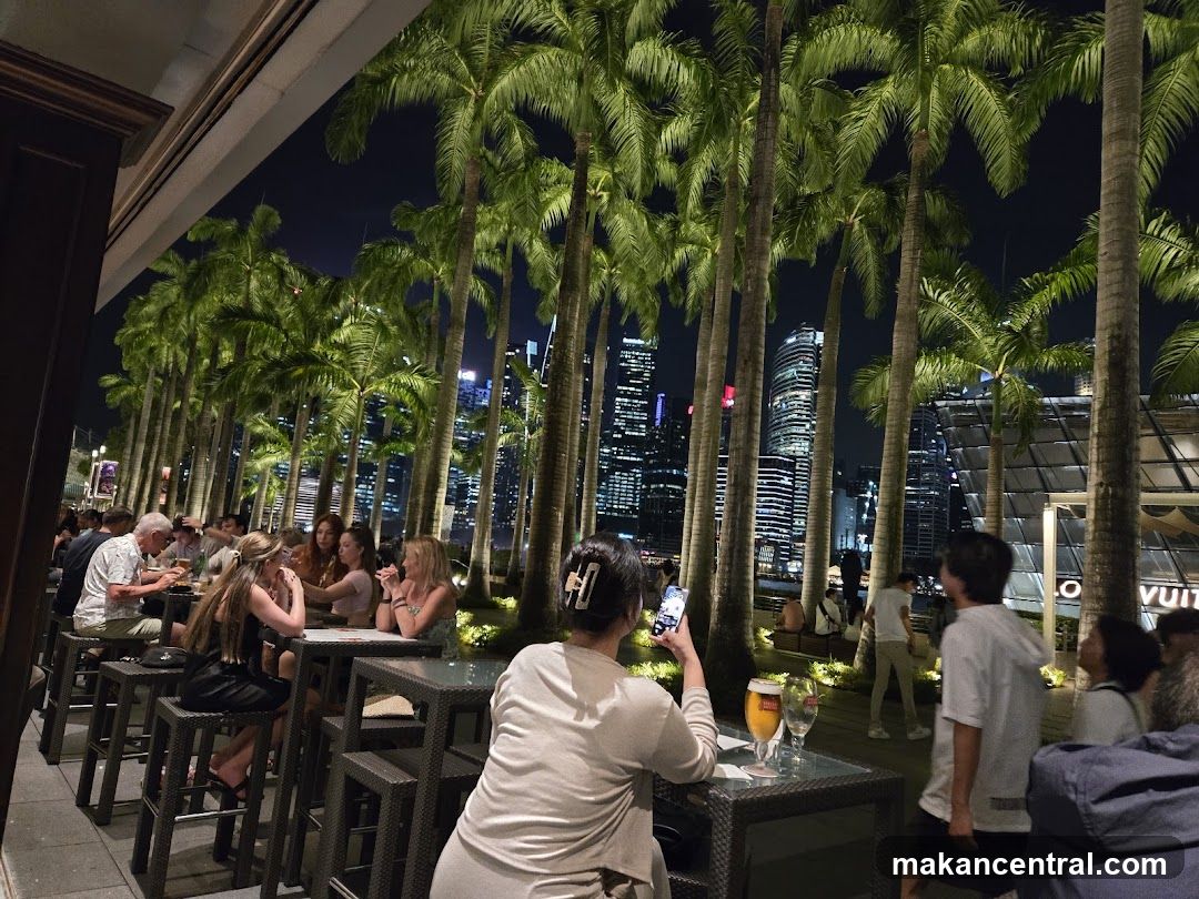 Outdoor dining with city skyline view