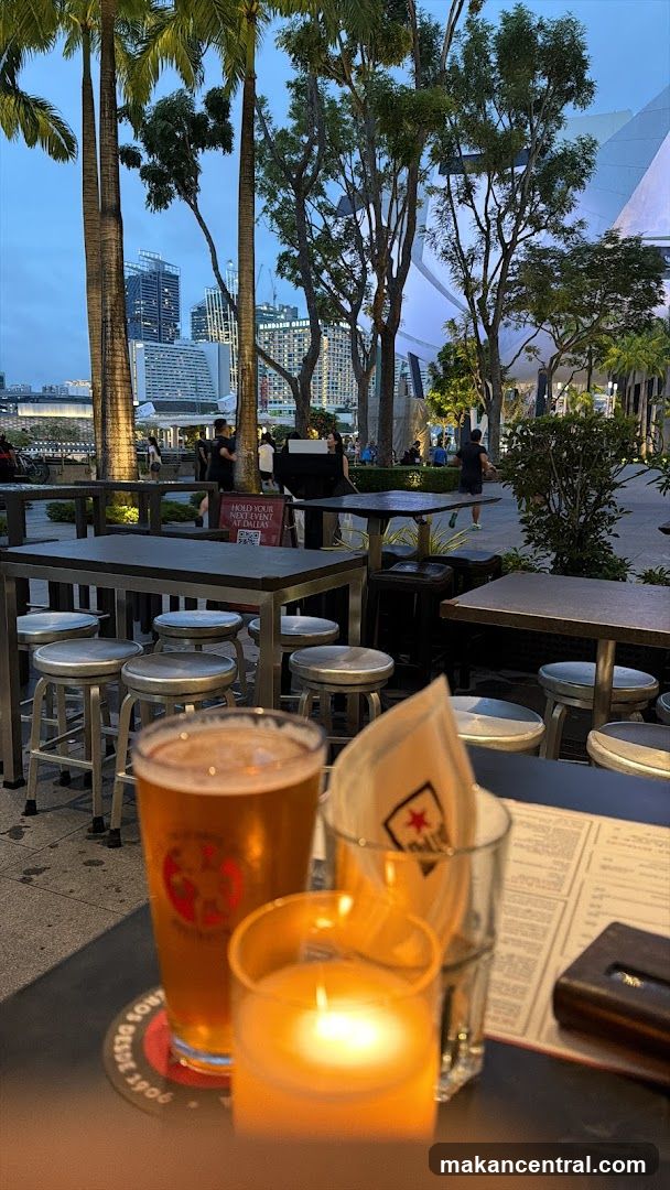 Outdoor seating with a beer and candle