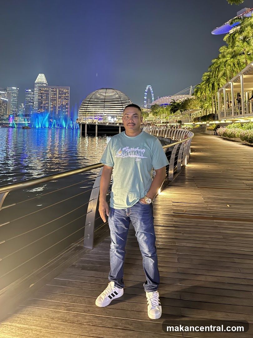 Man Posing by the Water at Night