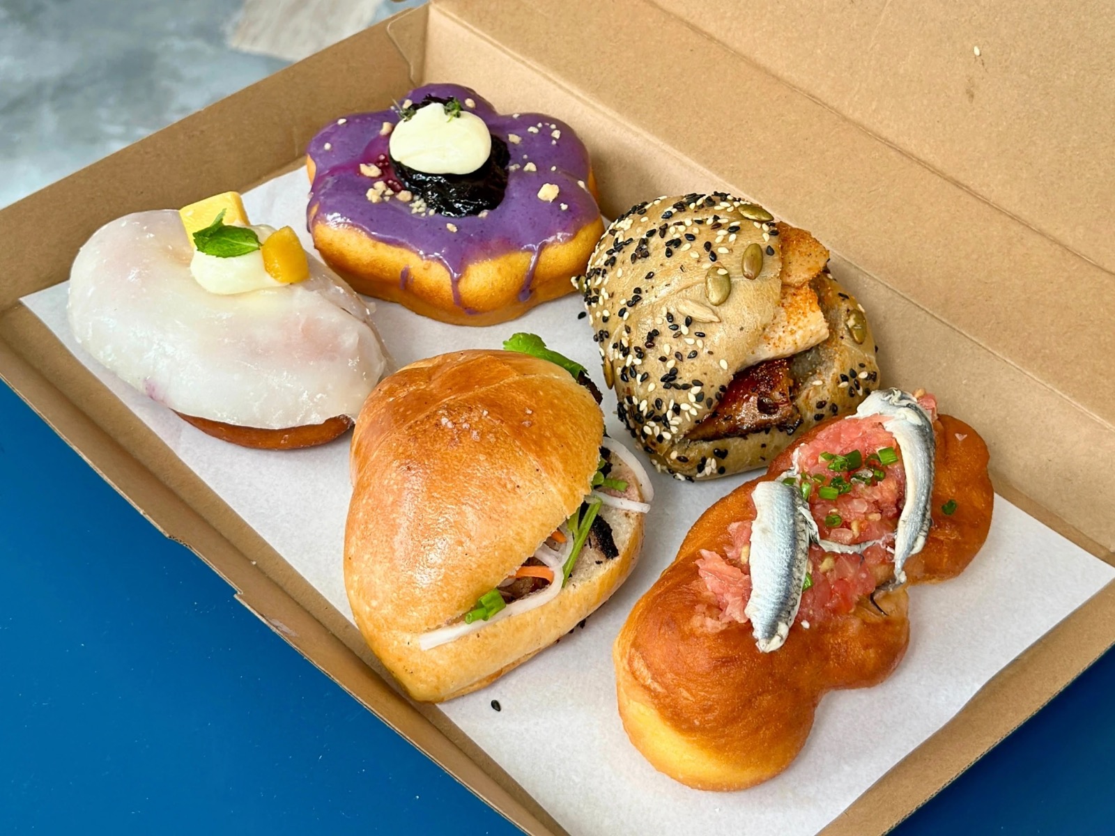 Cloudmills bakery box with Unagi Moon, banh mi, Pan con Tomate and doughnuts at Claymore Drive
