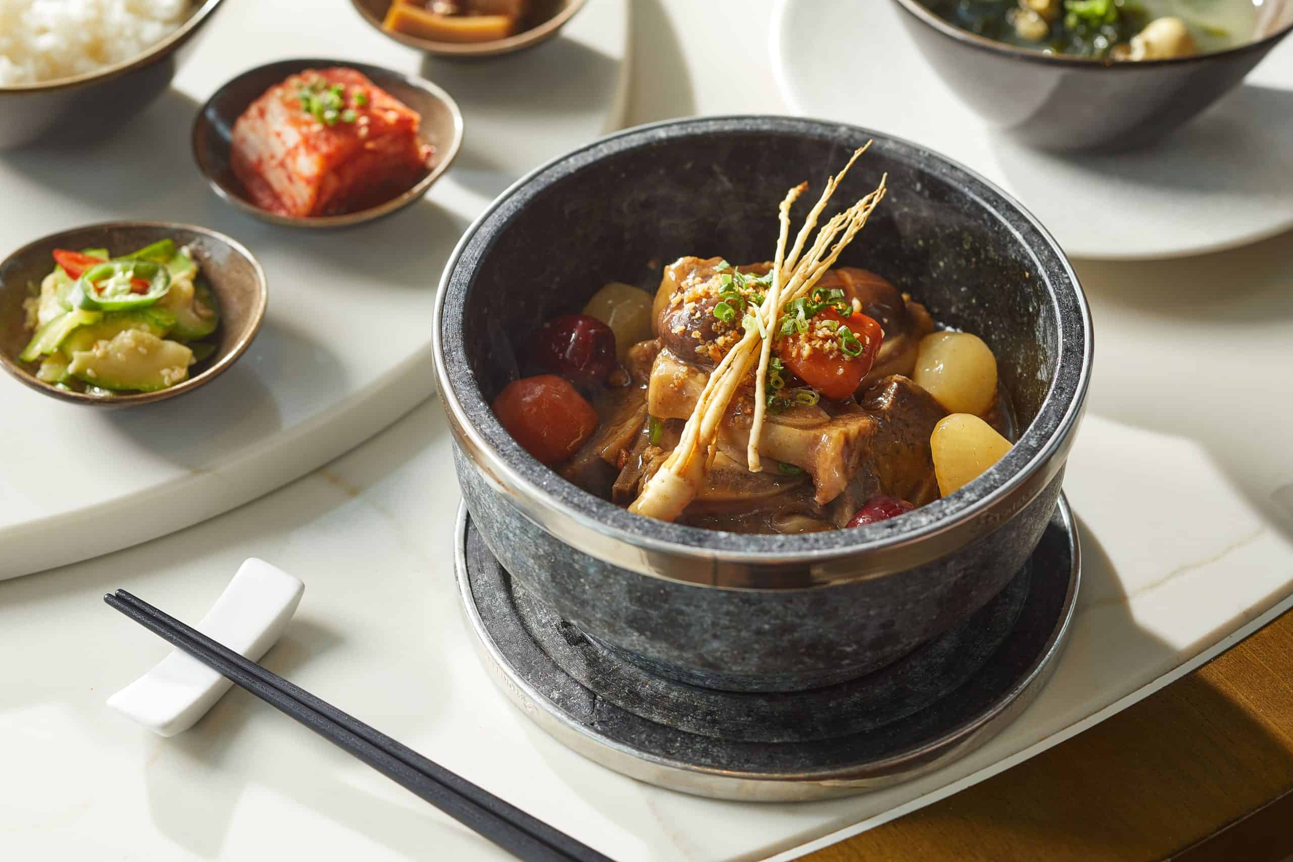 Korean-Italian collaboration plated dish at a hotel restaurant in Singapore, illustrating the kind of chef-led National Day 2026 menus at voco Orchard and Pan Pacific